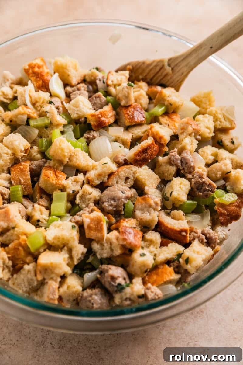 Classic Turkey Sausage Dressing 13 Turkey sausage stuffing mixture tossed together in a mixing bowl before baking.