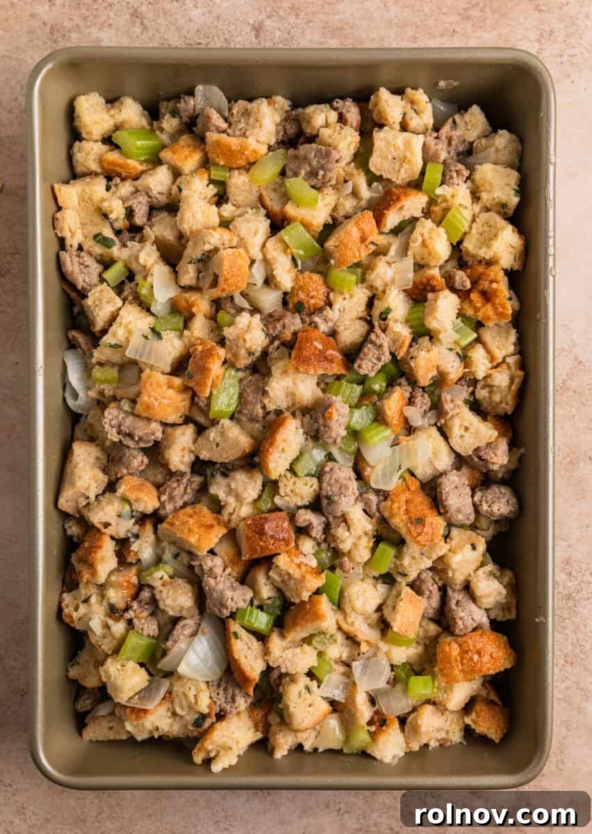 Classic Turkey Sausage Dressing 14 Unbaked turkey sausage stuffing ready in a baking pan.