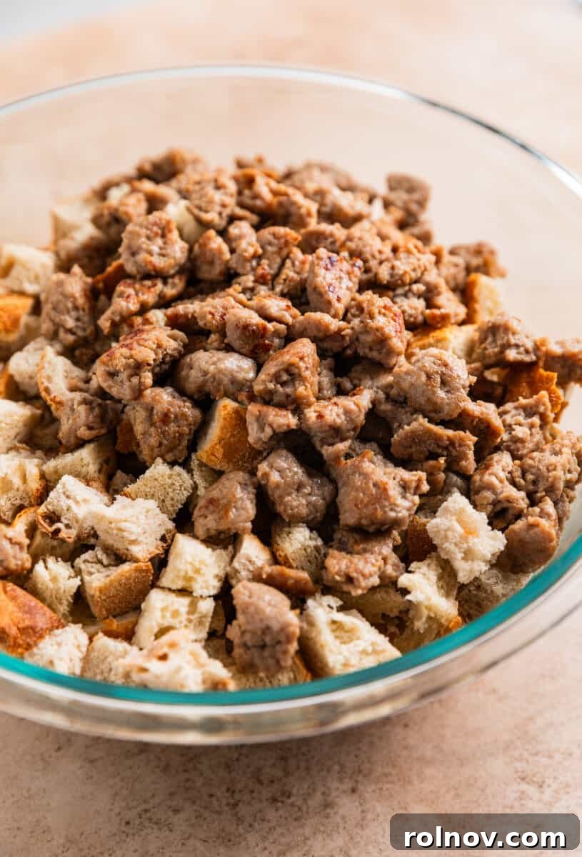 Classic Turkey Sausage Dressing 8 Cooked turkey sausage and dry bread added to a large mixing bowl.