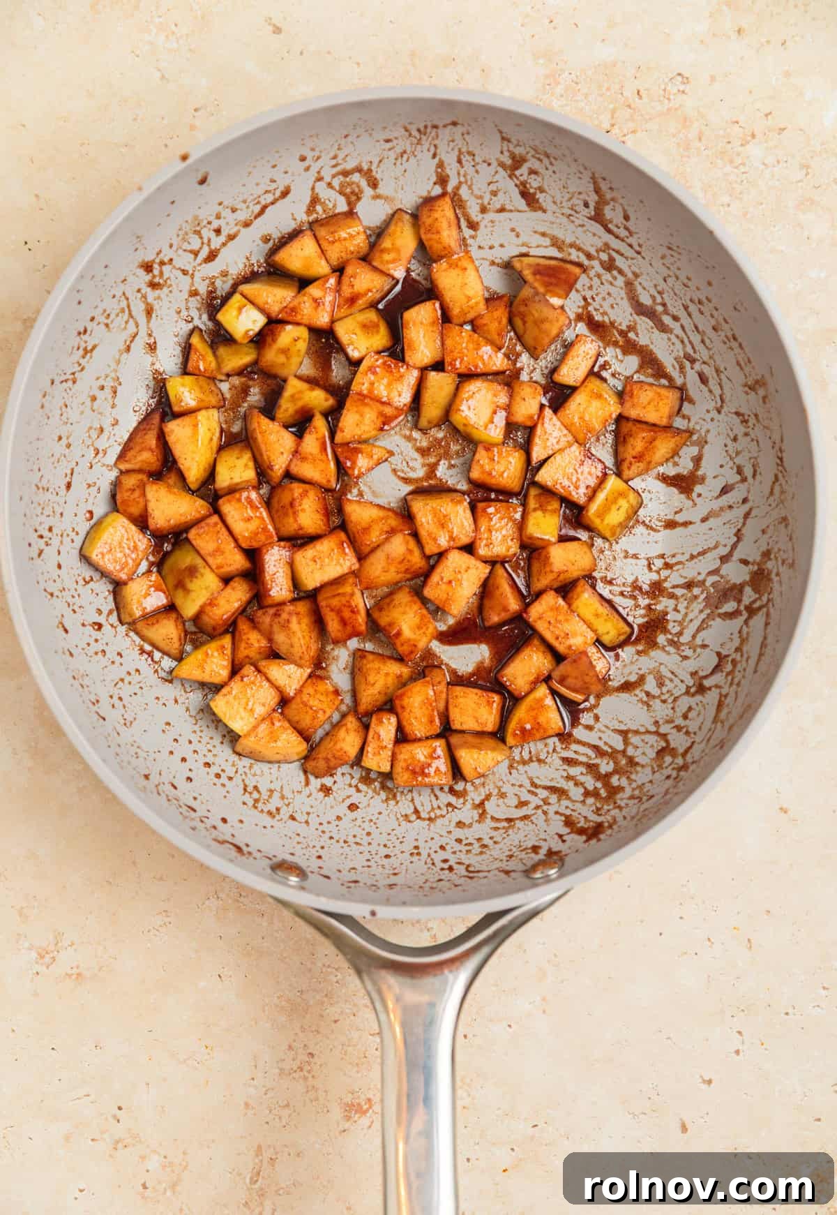 Apple Pie Overnight Oats 6 Cinnamon apples perfectly cooked and coated in a glistening maple sauce within the skillet.