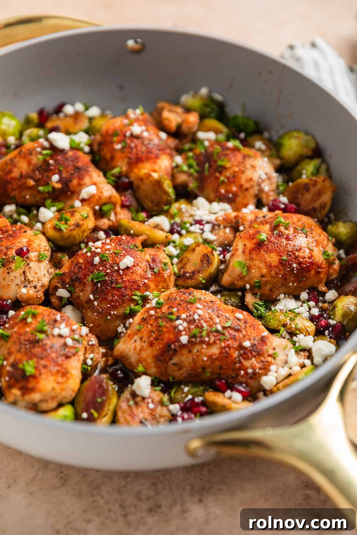 Sheet Pan Golden Chicken and Roasted Brussels Sprouts 3 Gray pan with dijon balsamic chicken thighs and brussel sprouts.