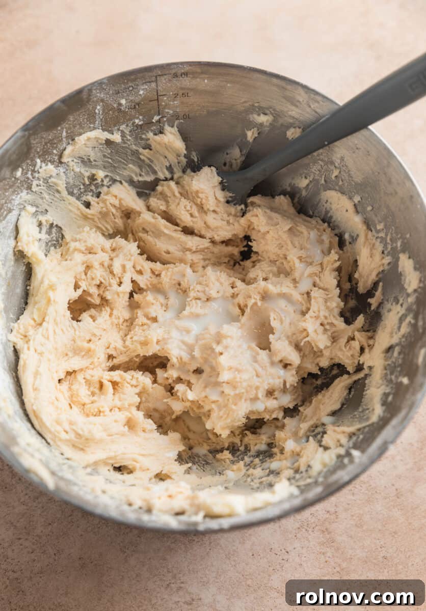 Ginger Cloud Cookies 15 Buttercream frosting in mixing bowl with cream added.