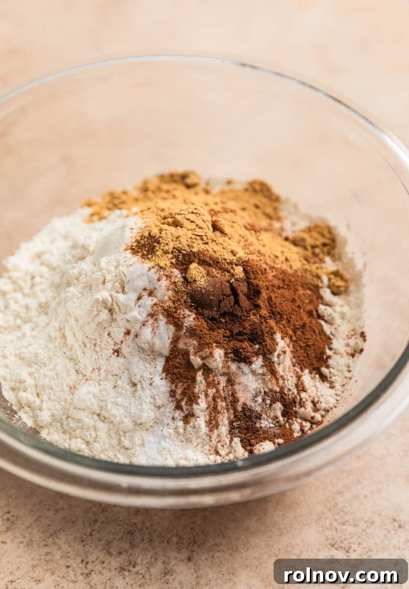 Ginger Cloud Cookies 6 Flour, cinnamon, ginger, cloves and baking soda in glass mixing bowl.