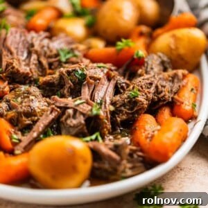 Hearty Crockpot Chuck Roast with tender vegetables, ready for a comforting meal.