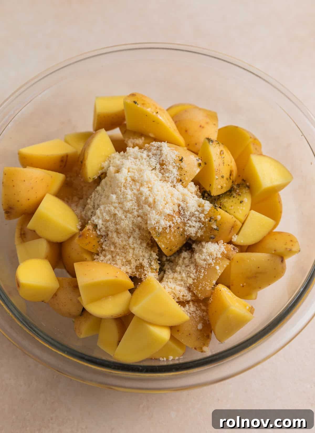 Quartered potatoes with parmesan and oil and seasonings poured over top.