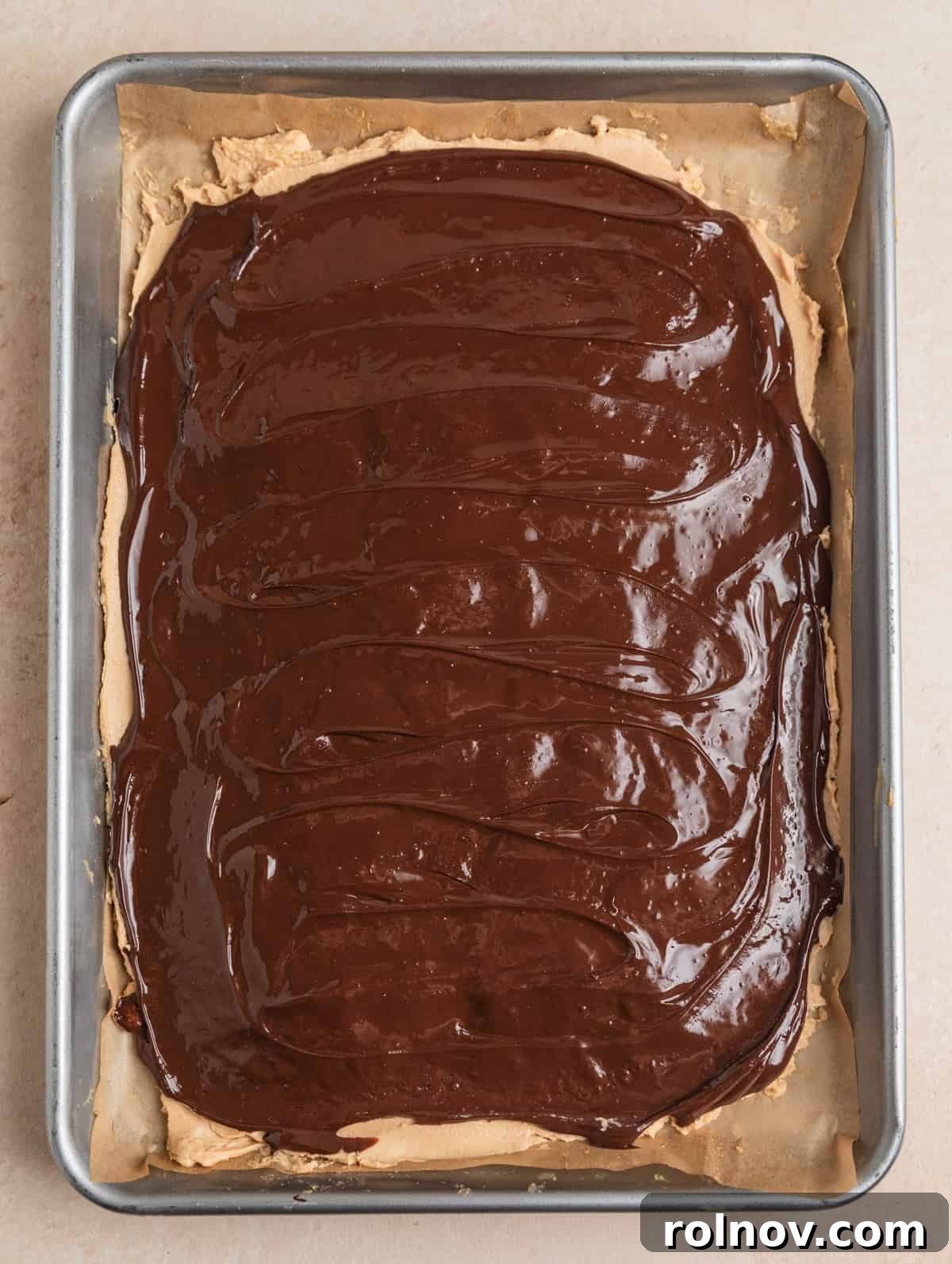 Frozen Greek Yogurt Bites 7 Melted dark chocolate evenly spread over top of the peanut butter yogurt bark layer, creating a delicious second layer.