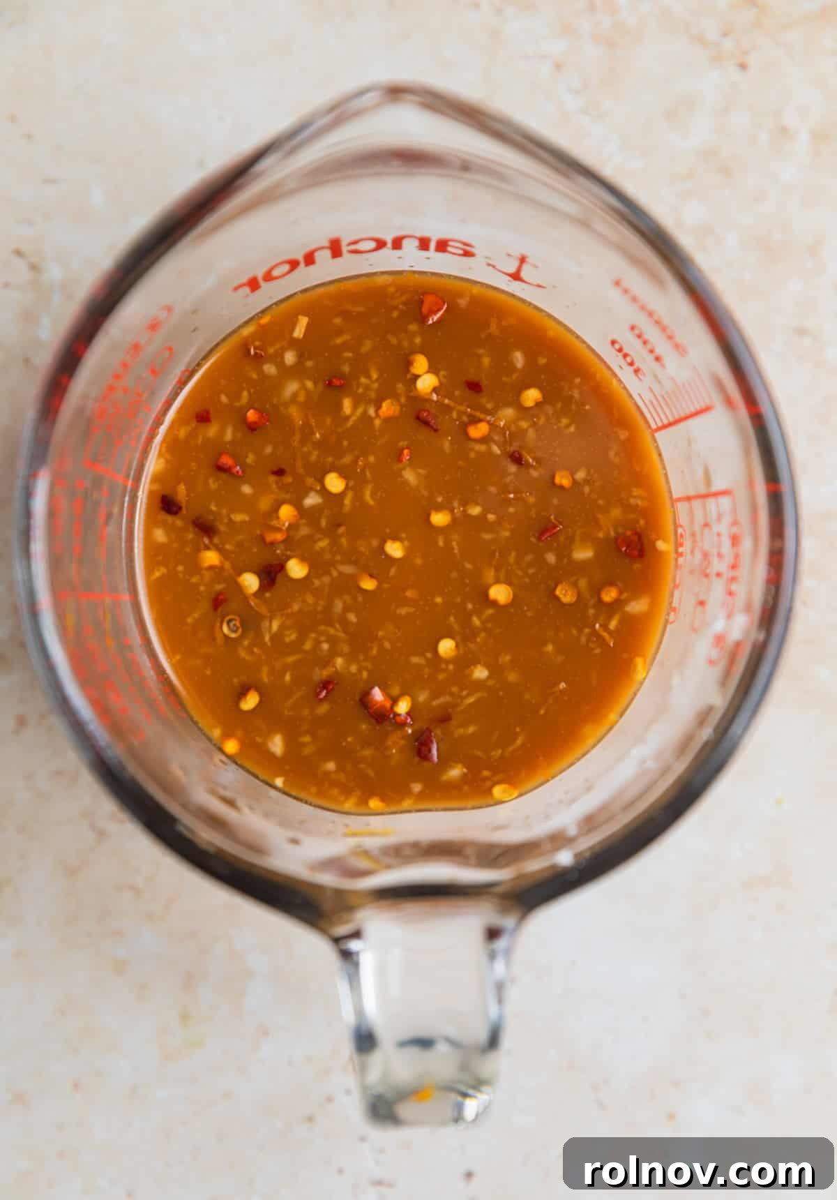 Sticky Teriyaki Ground Beef 5 Whisked teriyaki sauce in glass measuring cup.