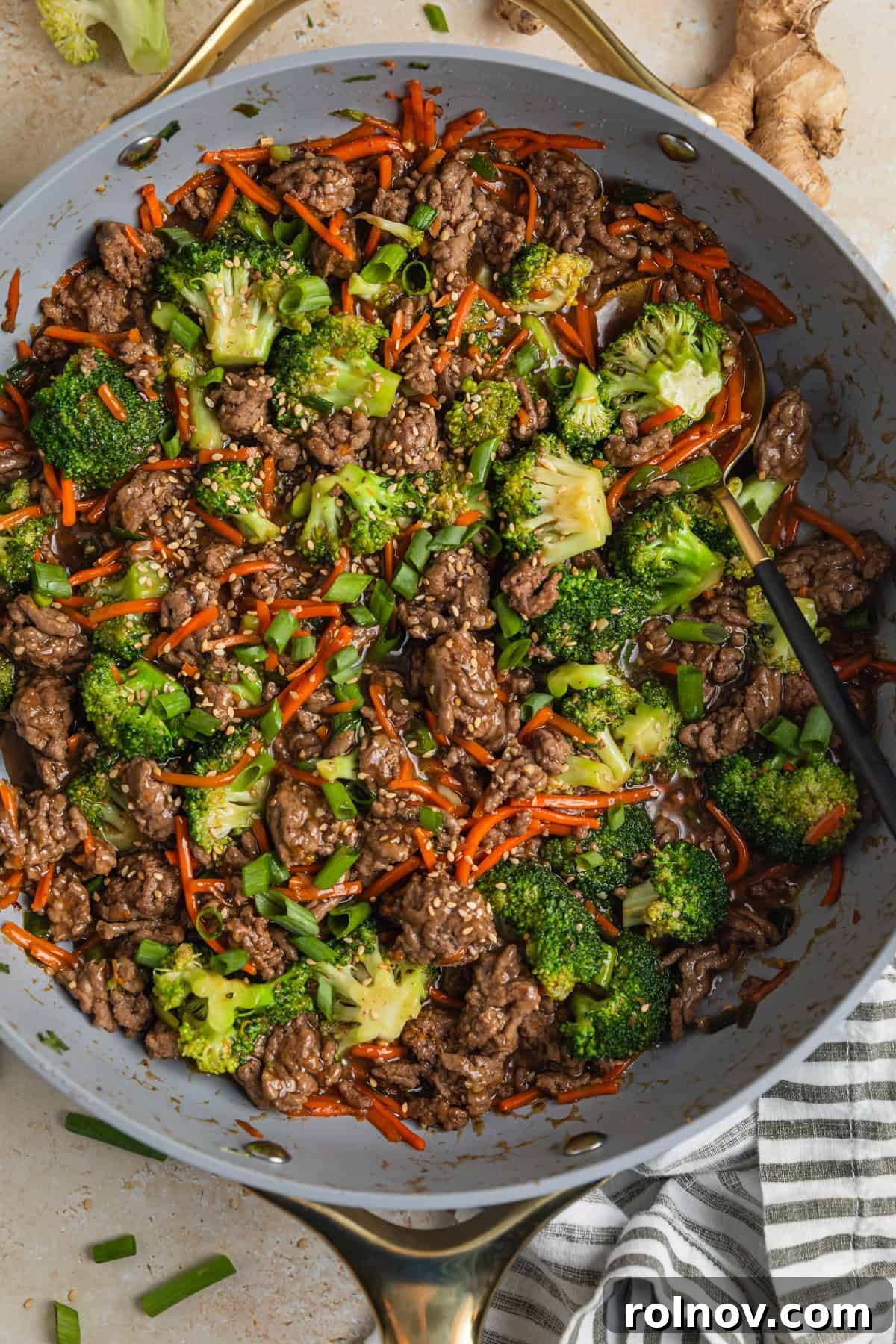 Sticky Teriyaki Ground Beef 9 Ground beef teriyaki stir fry prepared in skillet topped with chopped green onions.