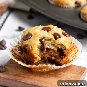 Tropical Banana Chocolate Chip Muffins 11 Banana Coconut Muffins with bite taken.