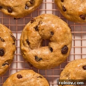Cinnamon raisin greek yogurt bagels on cooling rack.