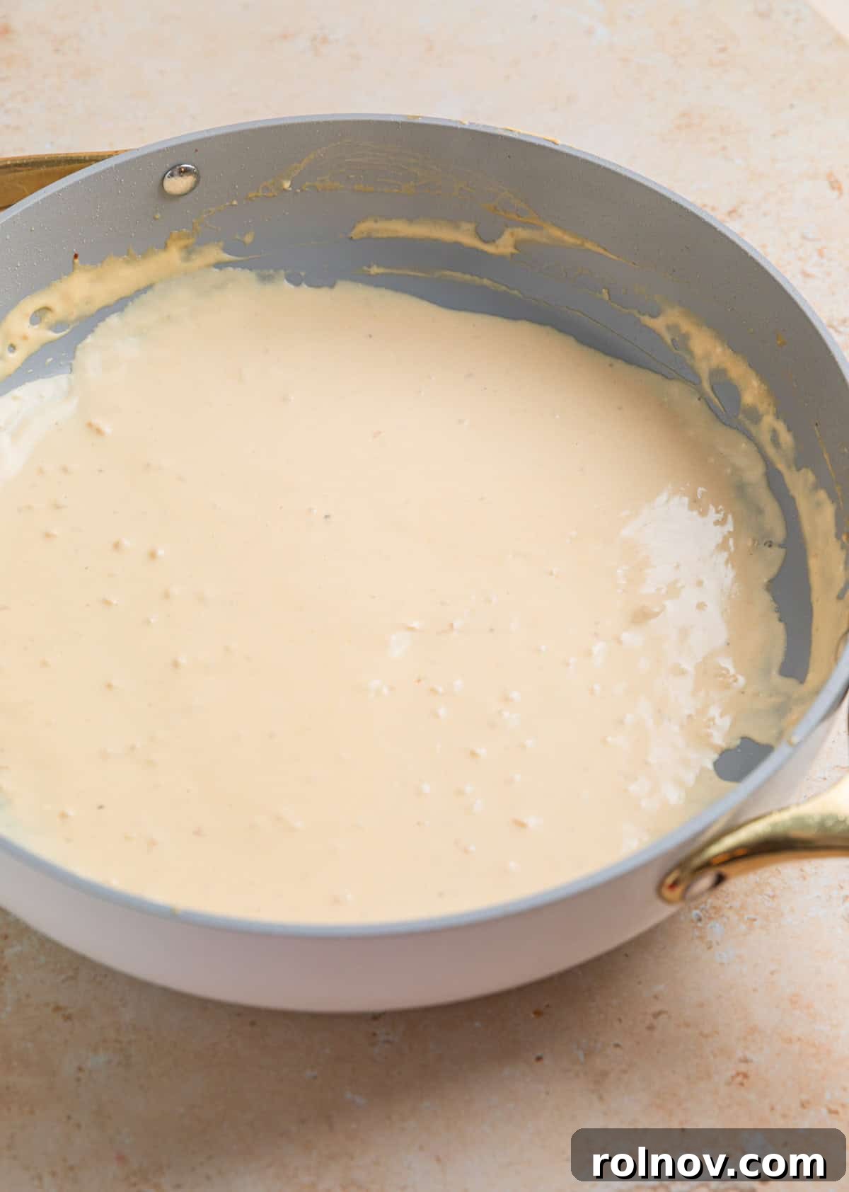 Cream cheese sauce in skillet.