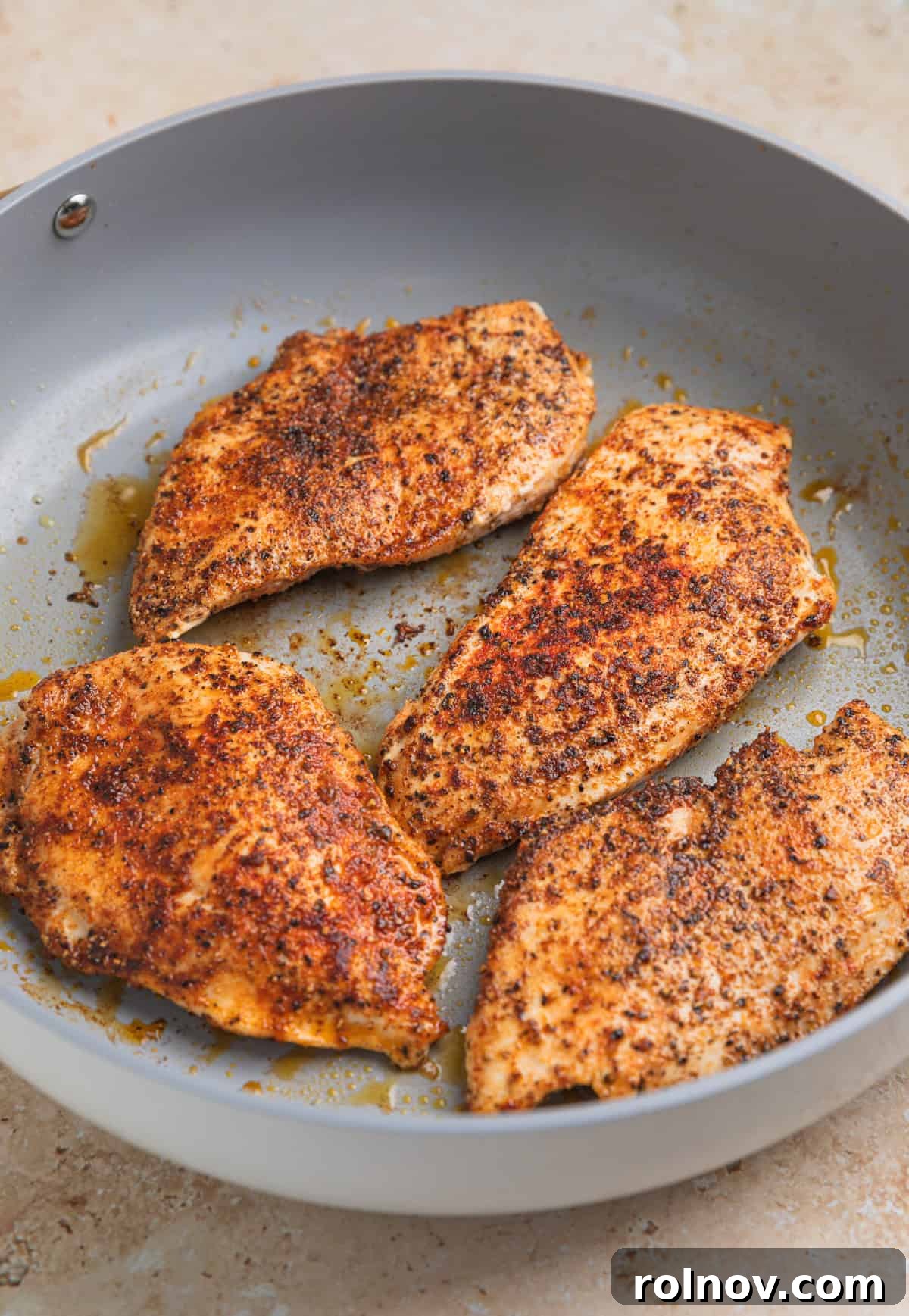 Rich Creamy Chicken Orzo 5 Seared chicken in oiled skilet.