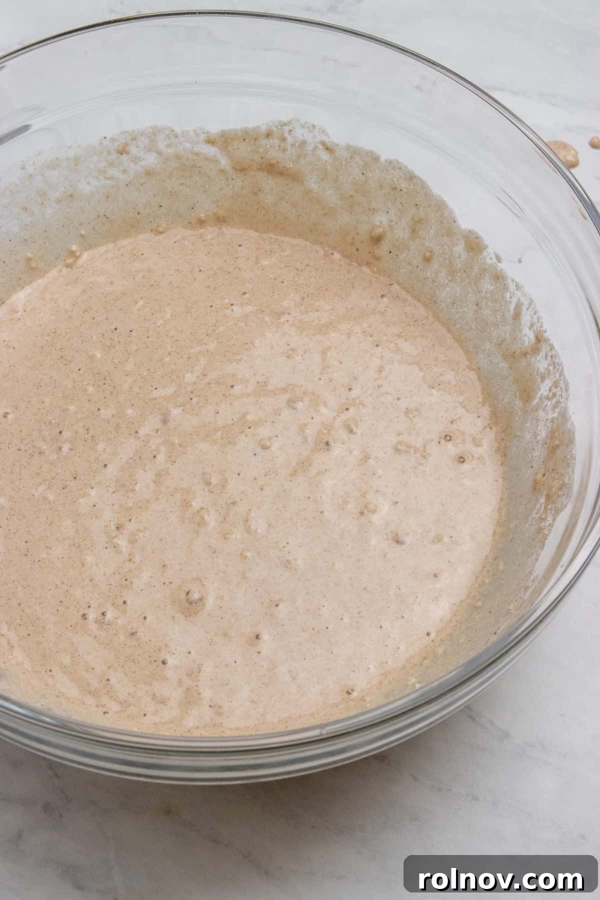 Thick, hearty vegan waffle batter in a mixing bowl, ready for the waffle iron.