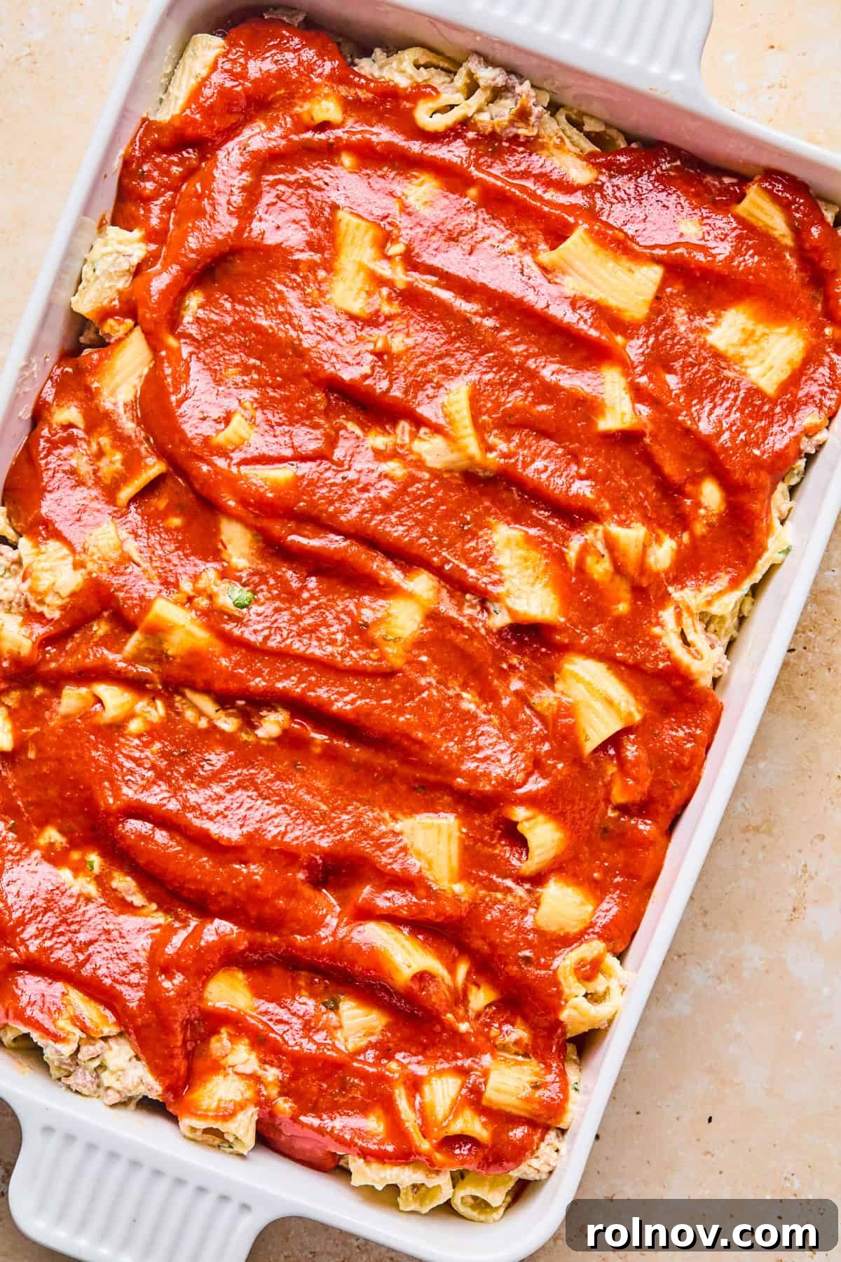 Rustic Italian Sausage Pasta Casserole 12 Marinara spread on top of pasta.