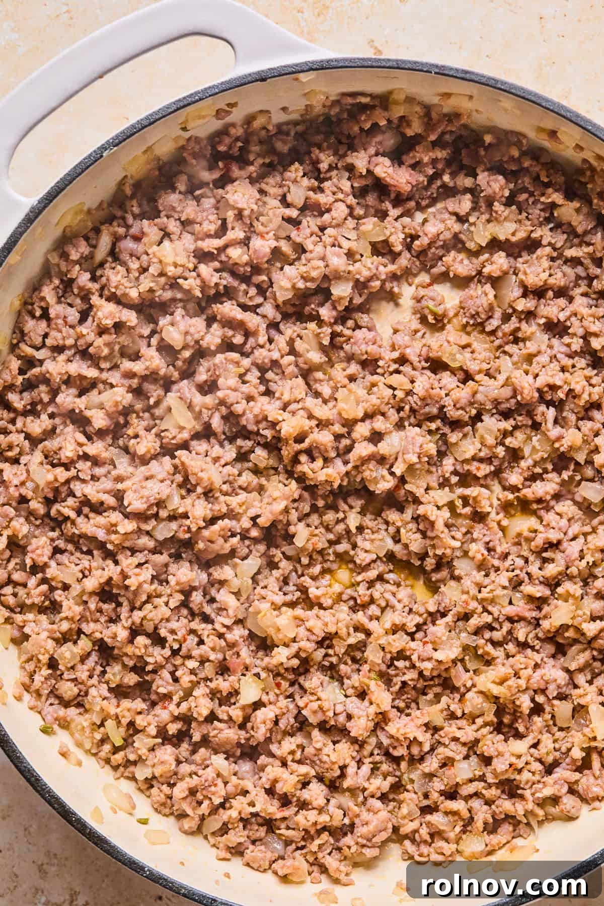 Rustic Italian Sausage Pasta Casserole 6 Italian sausage and onions browned in skillet.