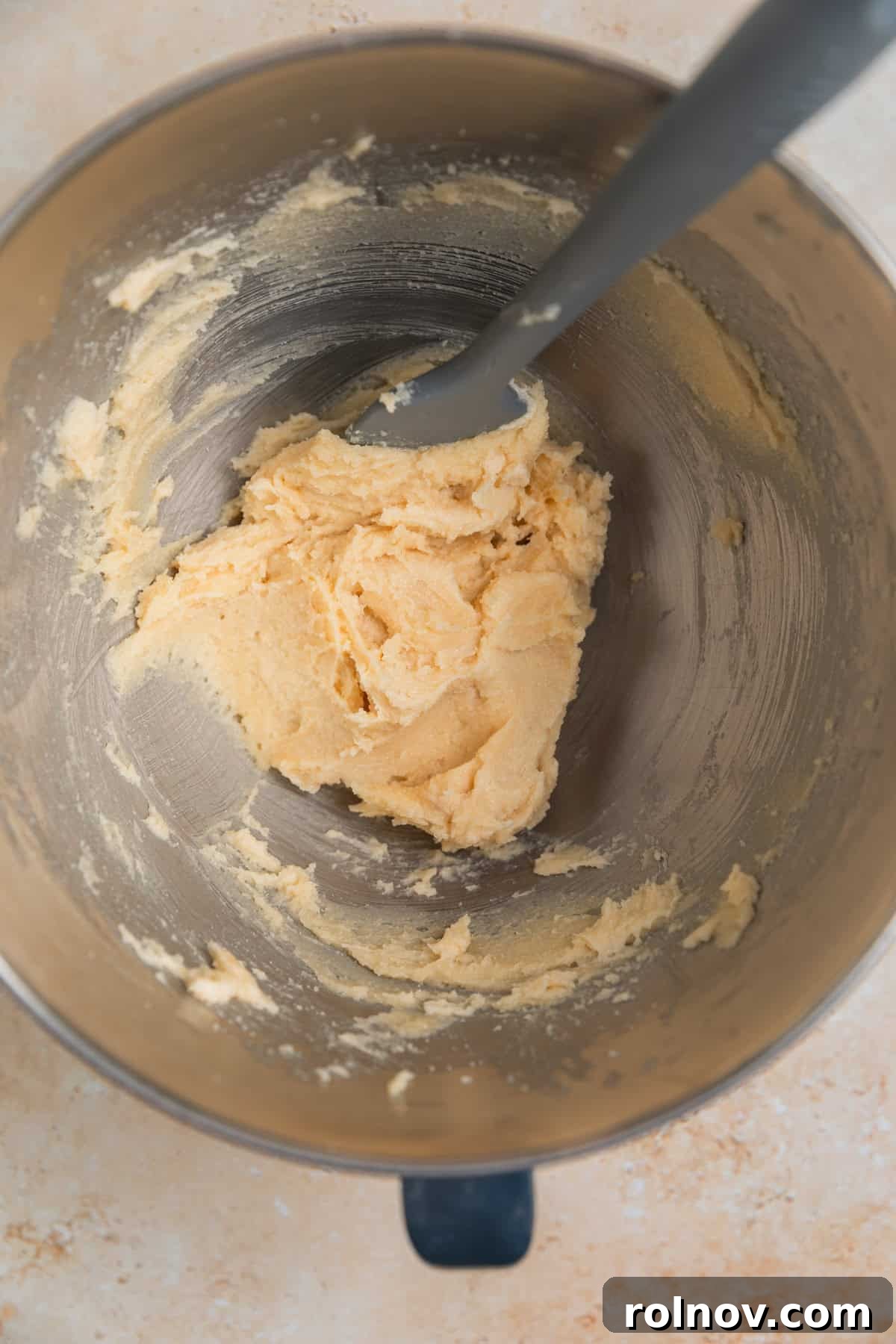 Irresistible Nutella Thumbprints 4 Creamed butter and sugar in mixing bowl with spatula propped to the side.