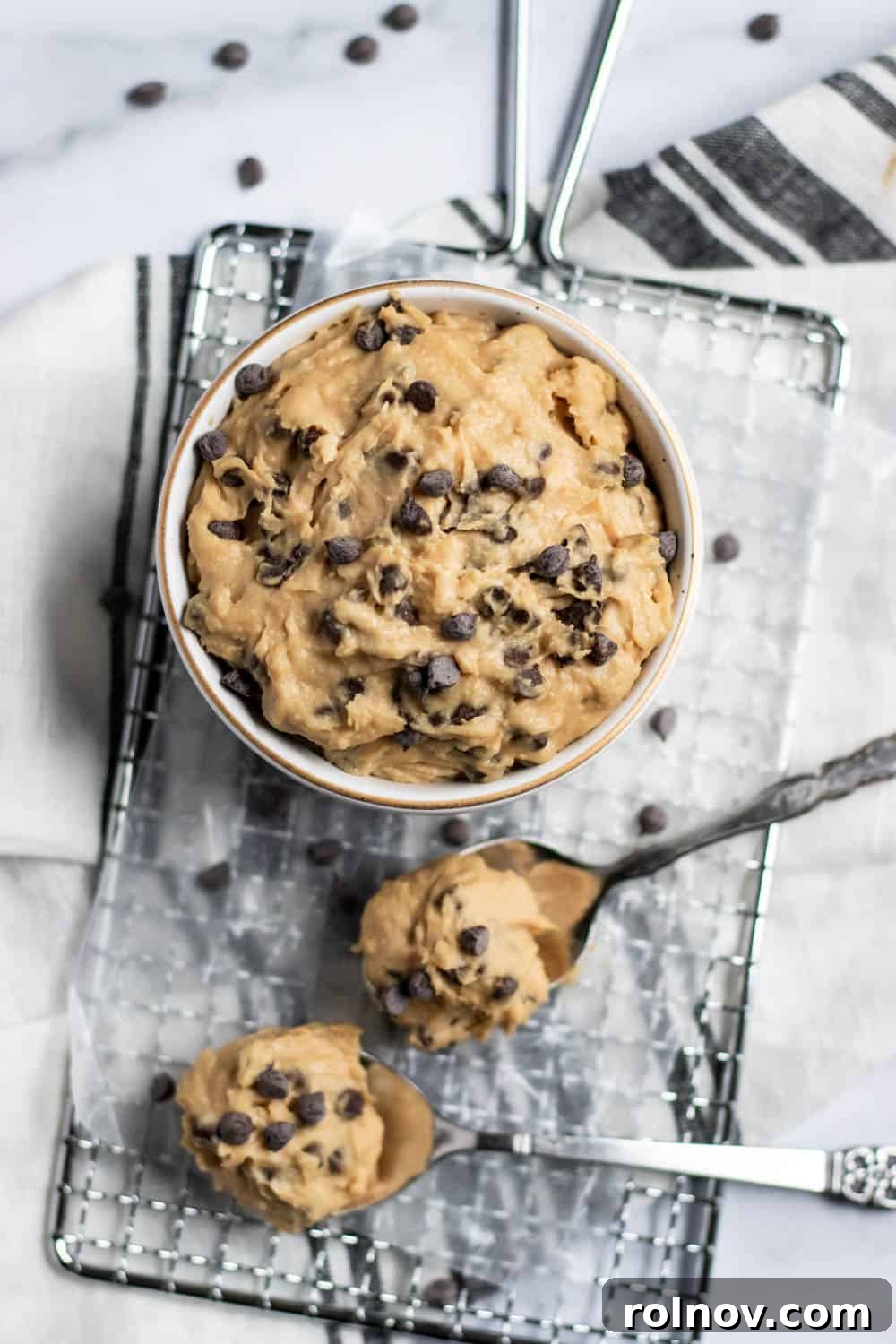 Secret Ingredient Cookie Dough Delight 2 Bowl of cookie dough on wax paper with spoons.