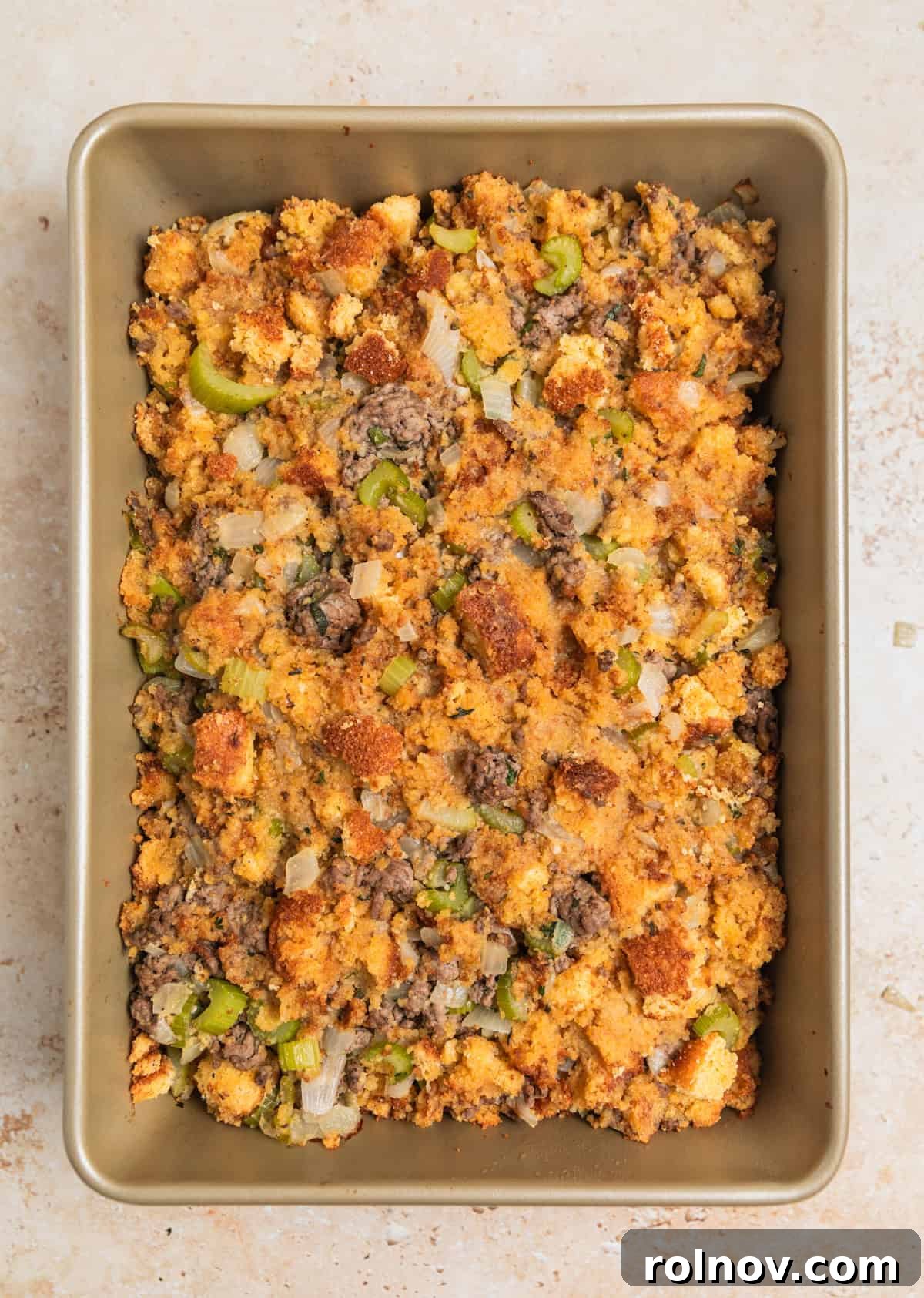Southern Beef Cornbread Dressing 11 Baked ground beef stuffing in pan.