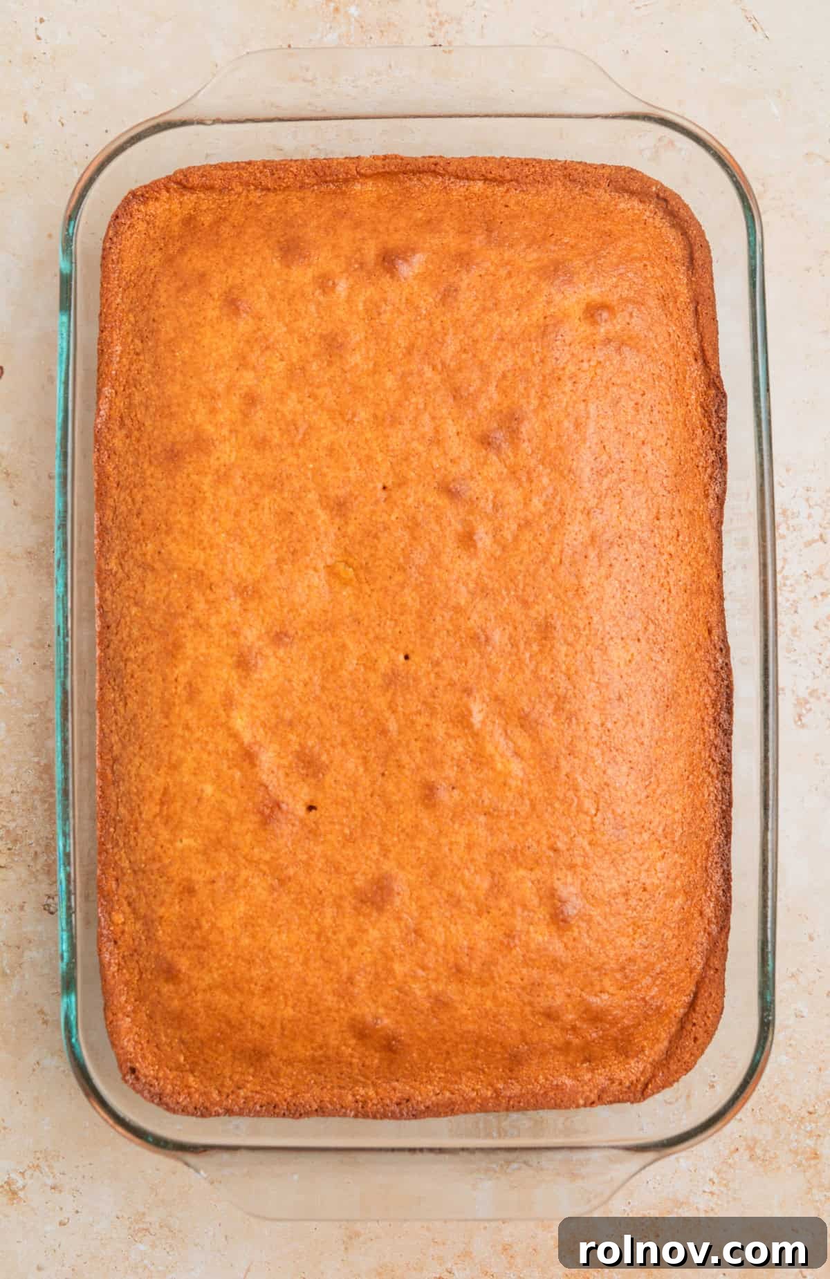 Southern Beef Cornbread Dressing 3 Baked honey cornbread in glass baking pan.