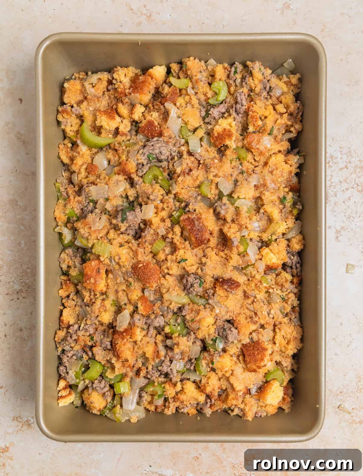 Southern Beef Cornbread Dressing 10 Cornbread and beef stuffing mixture in baking pan before being cooked.