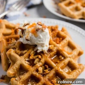 Rustic Carrot Cake Waffles 5 A single, perfectly cooked whole wheat carrot cake waffle, ready to be served, highlighting its wholesome ingredients and inviting texture.