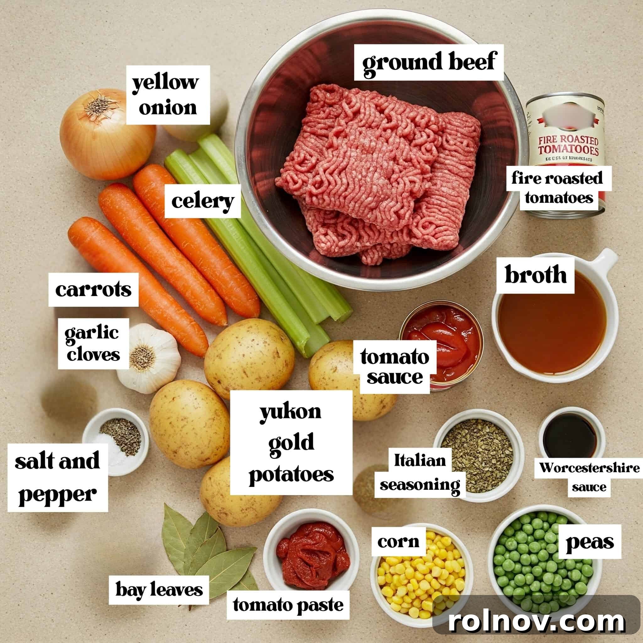 Hearty Slow Cooker Ground Beef Soup 3 Ground beef, peas, corn, carrots, potatoes, and other ingredients laid out on a kitchen surface.
