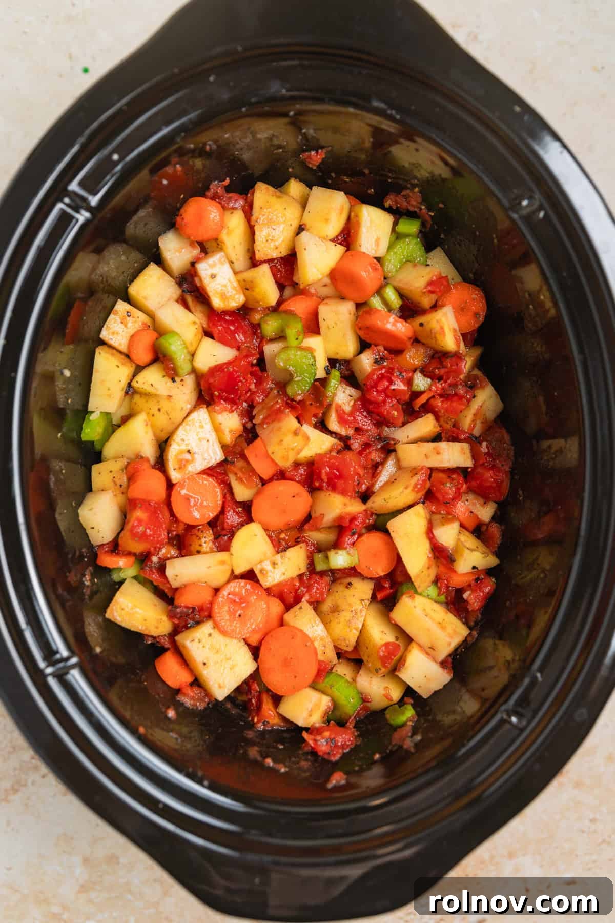 Hearty Slow Cooker Ground Beef Soup 4 Mixed soup ingredients in slow cooker before adding beef.