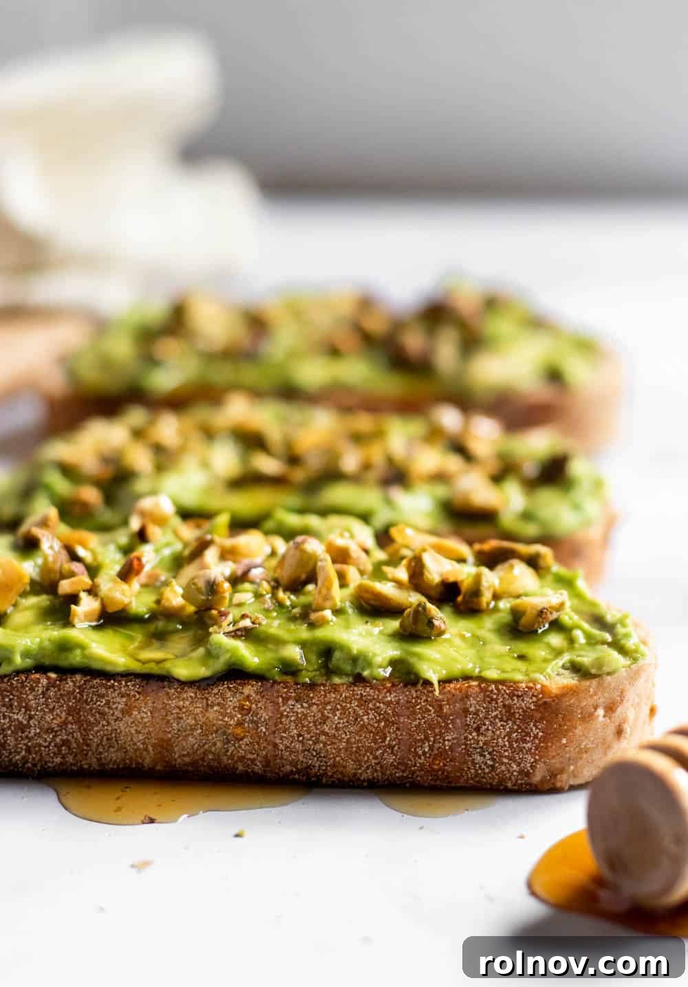 Simple Avocado Toast with Honey and Pistachios 4 Close-up of Honey Pistachio Avocado Toast with flaky sea salt