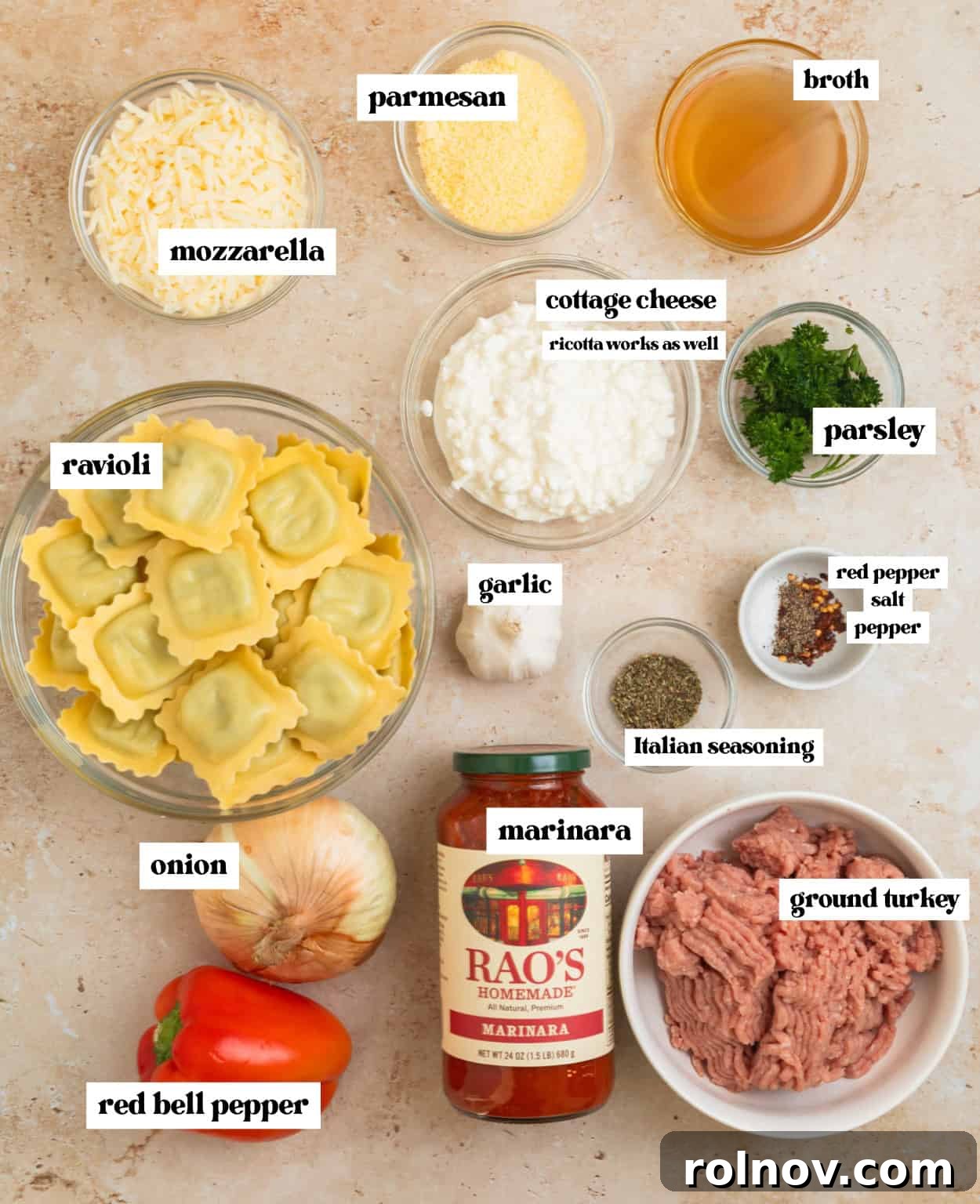 One-Pan Ravioli Lasagna 3 Cheese, ravioli, ground turkey, seasoning and other ingredients arranged on surface.