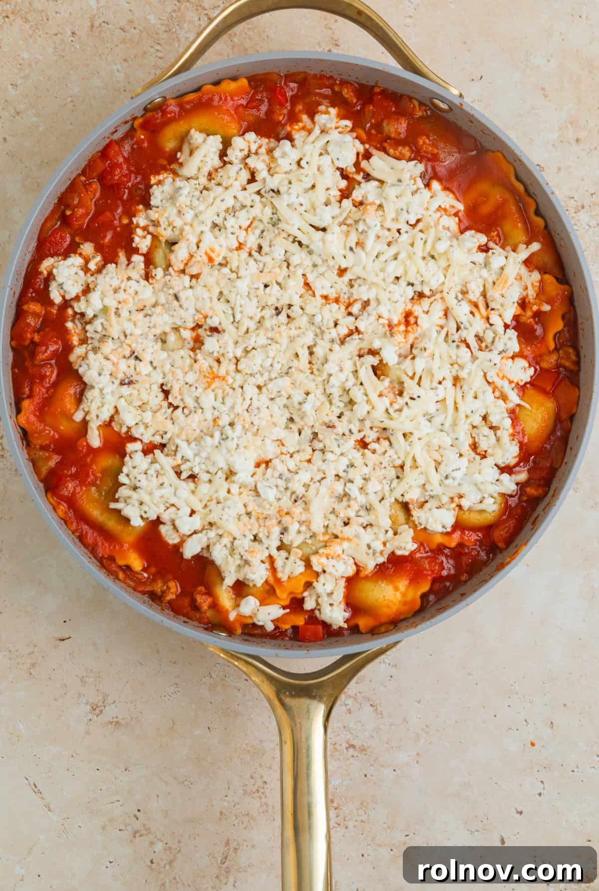 One-Pan Ravioli Lasagna 10 Cottage cheese lasagna mixture spread over top of lasagna in skillet.