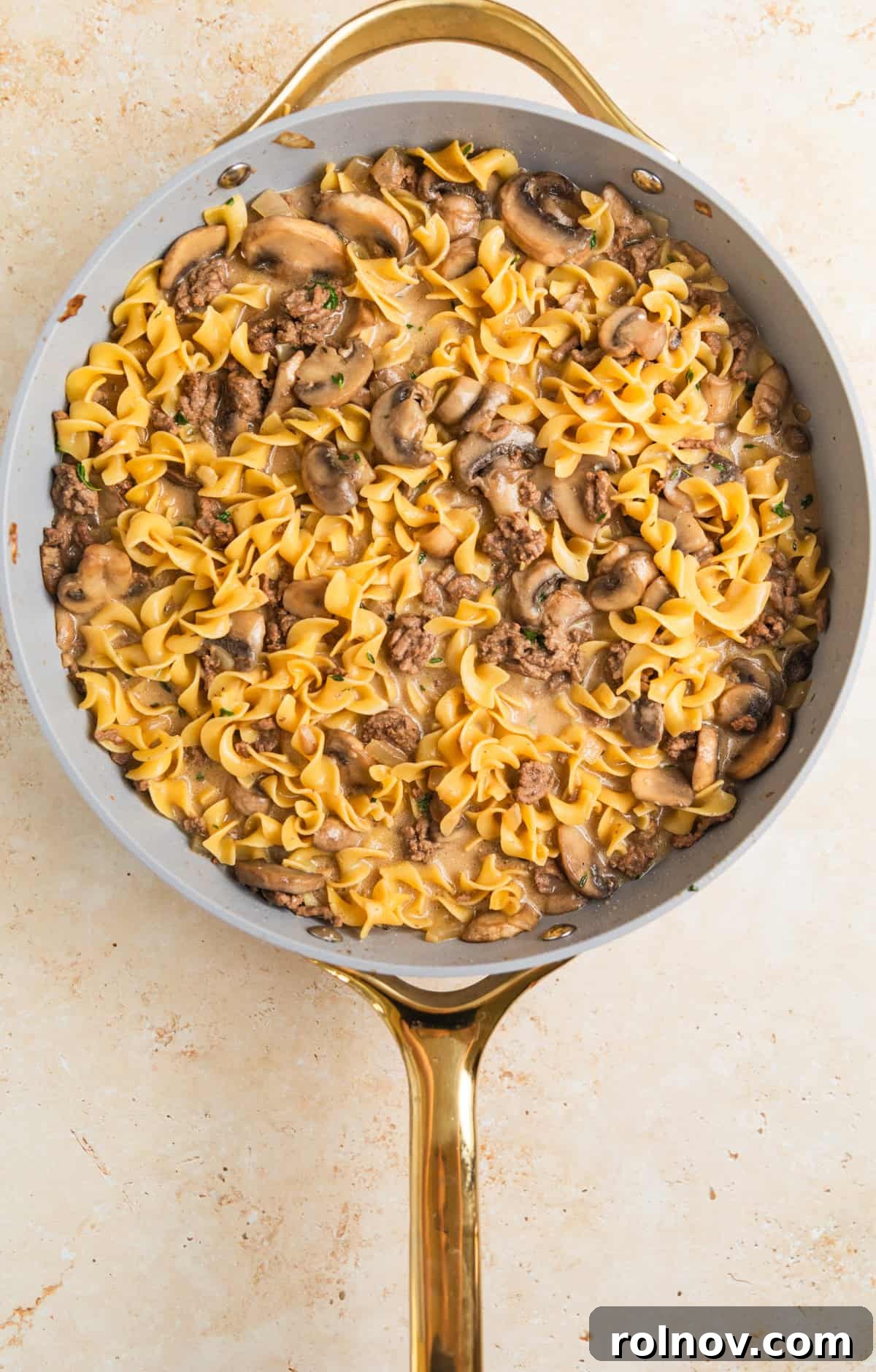 Creamy One-Pot Ground Beef Stroganoff 9 Sour cream and cream cheese added to one-pot beef stroganoff in pan.