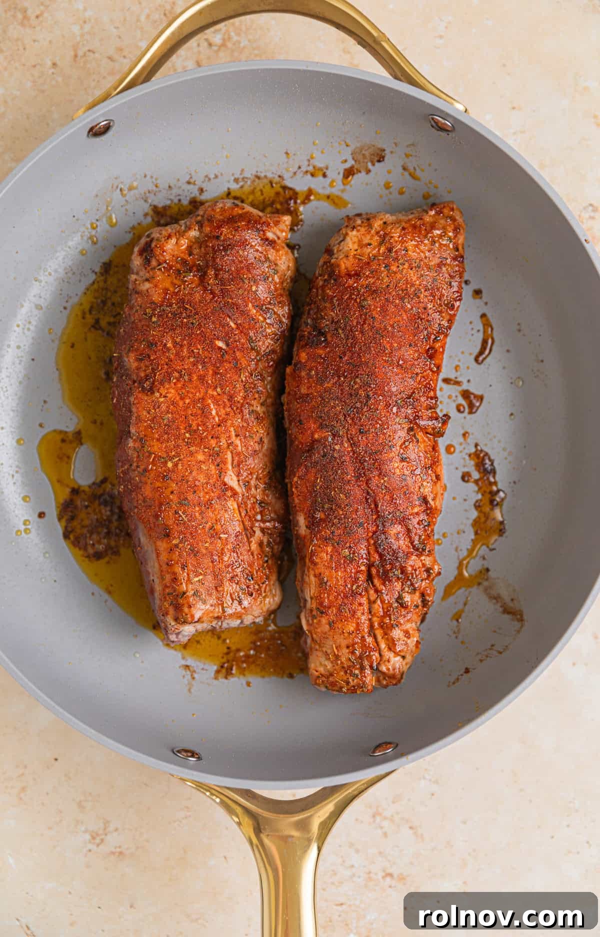 Seared Pork Tenderloin with Dijon Cream 6 Seared pork tenderloin in skillet.