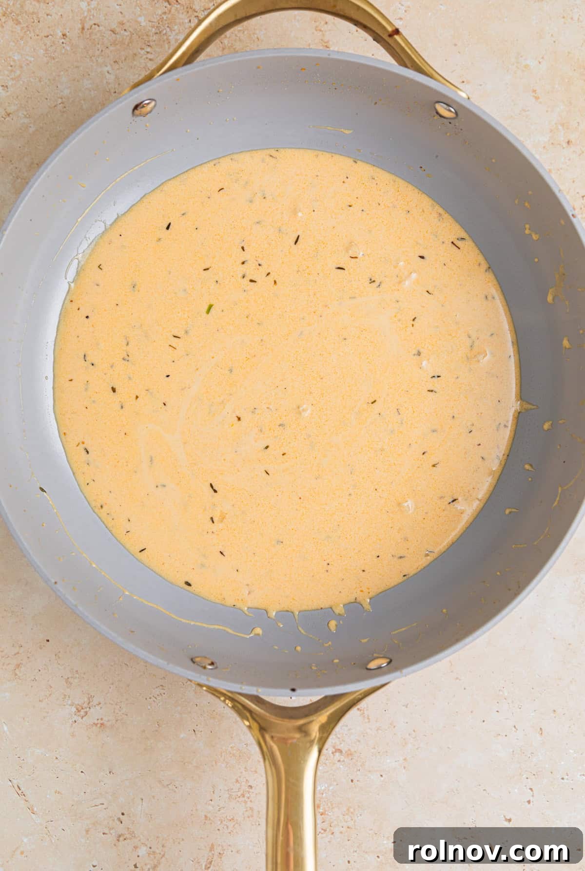 Seared Pork Tenderloin with Dijon Cream 9 Creamy mustard sauce in skillet.