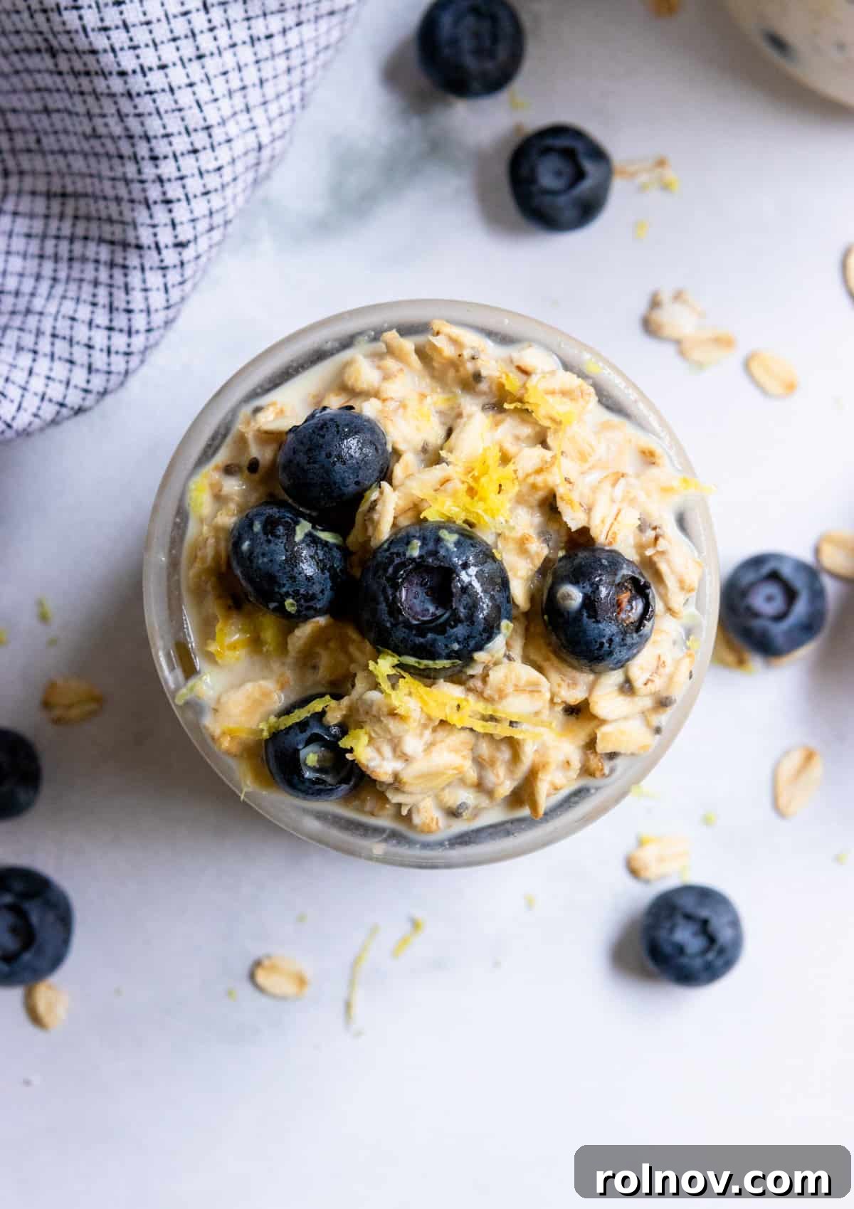 Overhead shot of oatmeal with blueberries and lemon zest.