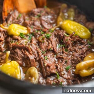 Melt-in-Your-Mouth Mississippi Pot Roast 8 Pot roast in crock pot with peppers and parsley.