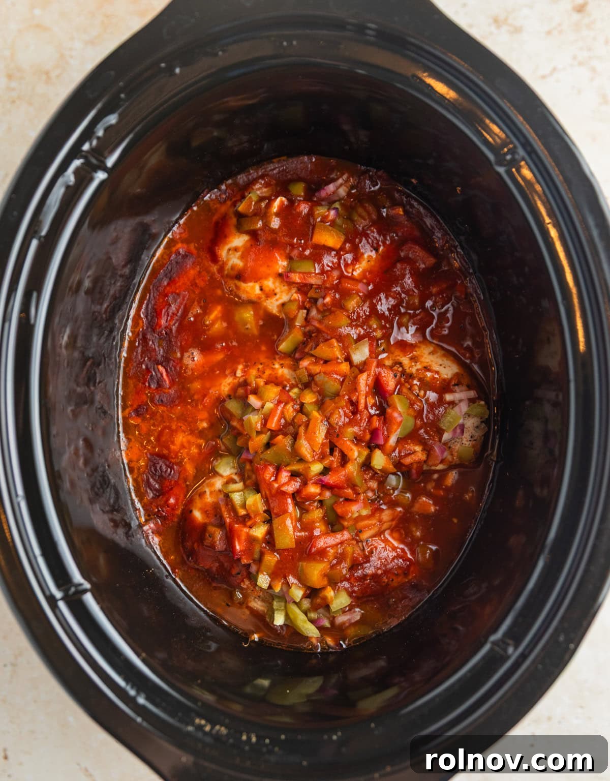Fall-Apart BBQ Chicken Tacos with Zesty Slaw 5 Cooked bbq chicken in slow cooker before shredding.