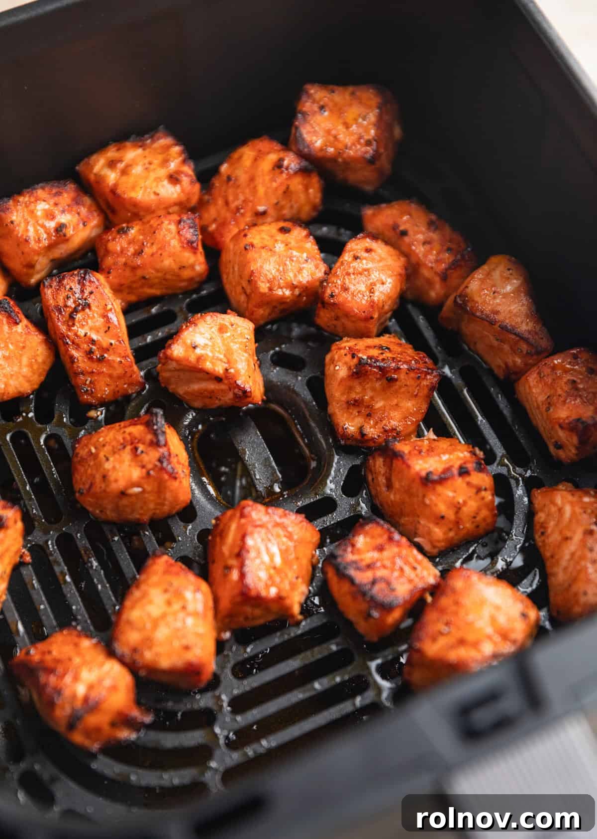 Crispy Air Fryer Salmon Bites 7 Air fried salmon bites in air frying basket.