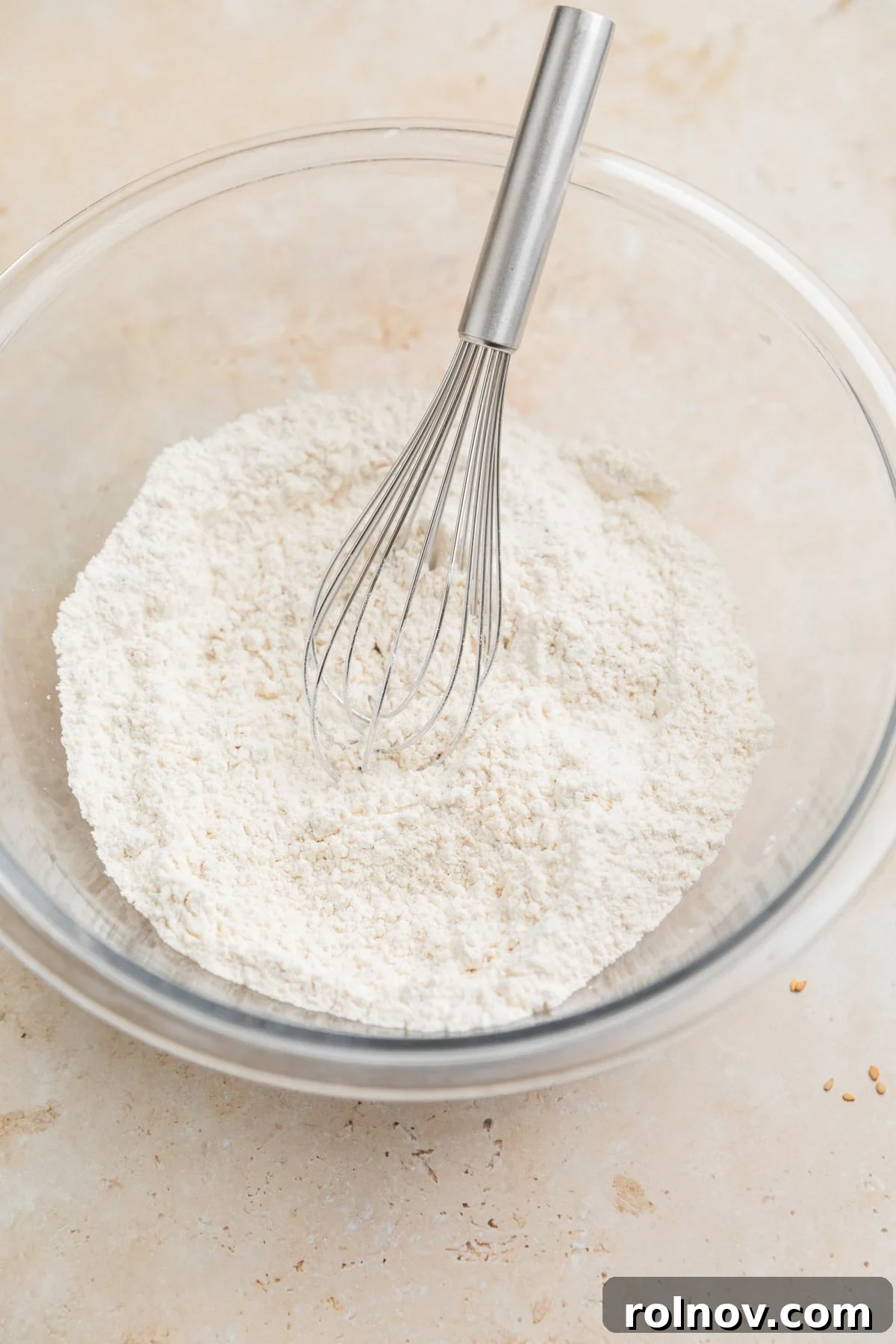 Cottage Cloud Waffles 3 Dry ingredients in a large mixing bowl with a whisk.