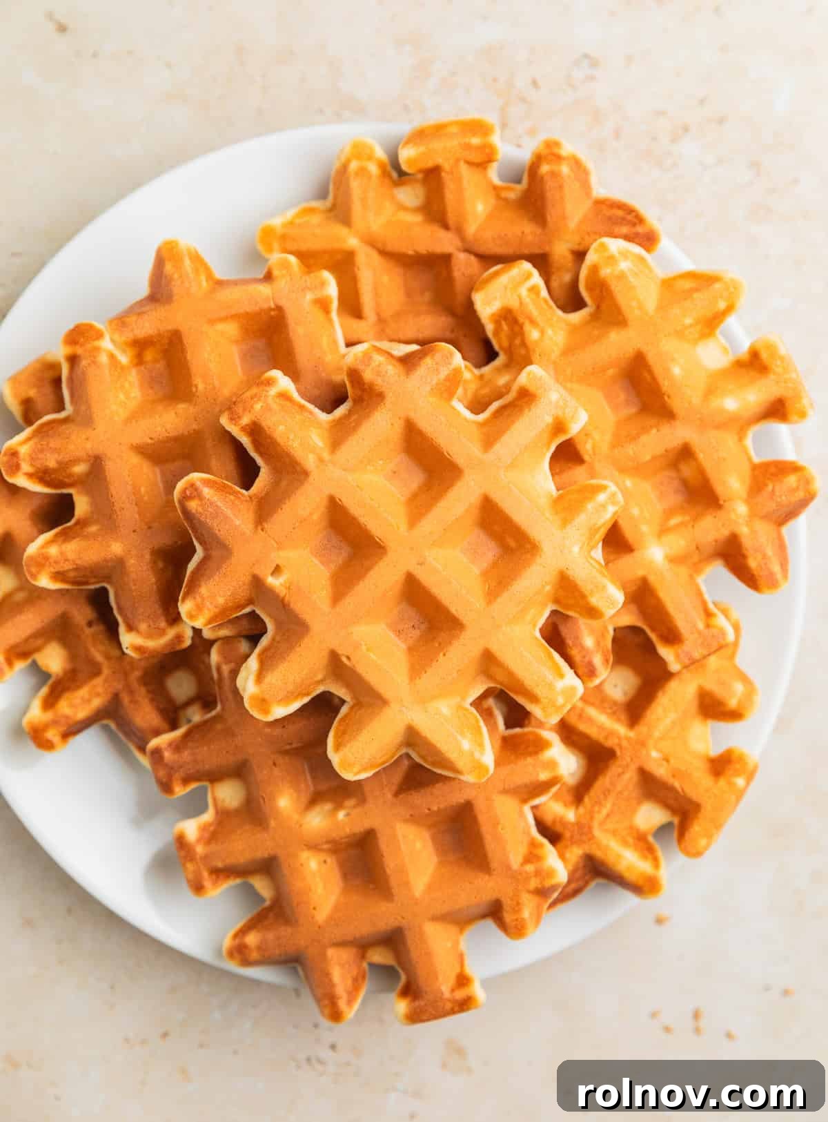 Cottage Cloud Waffles 6 A stack of golden protein cottage cheese waffles on a plate, ready to be served.