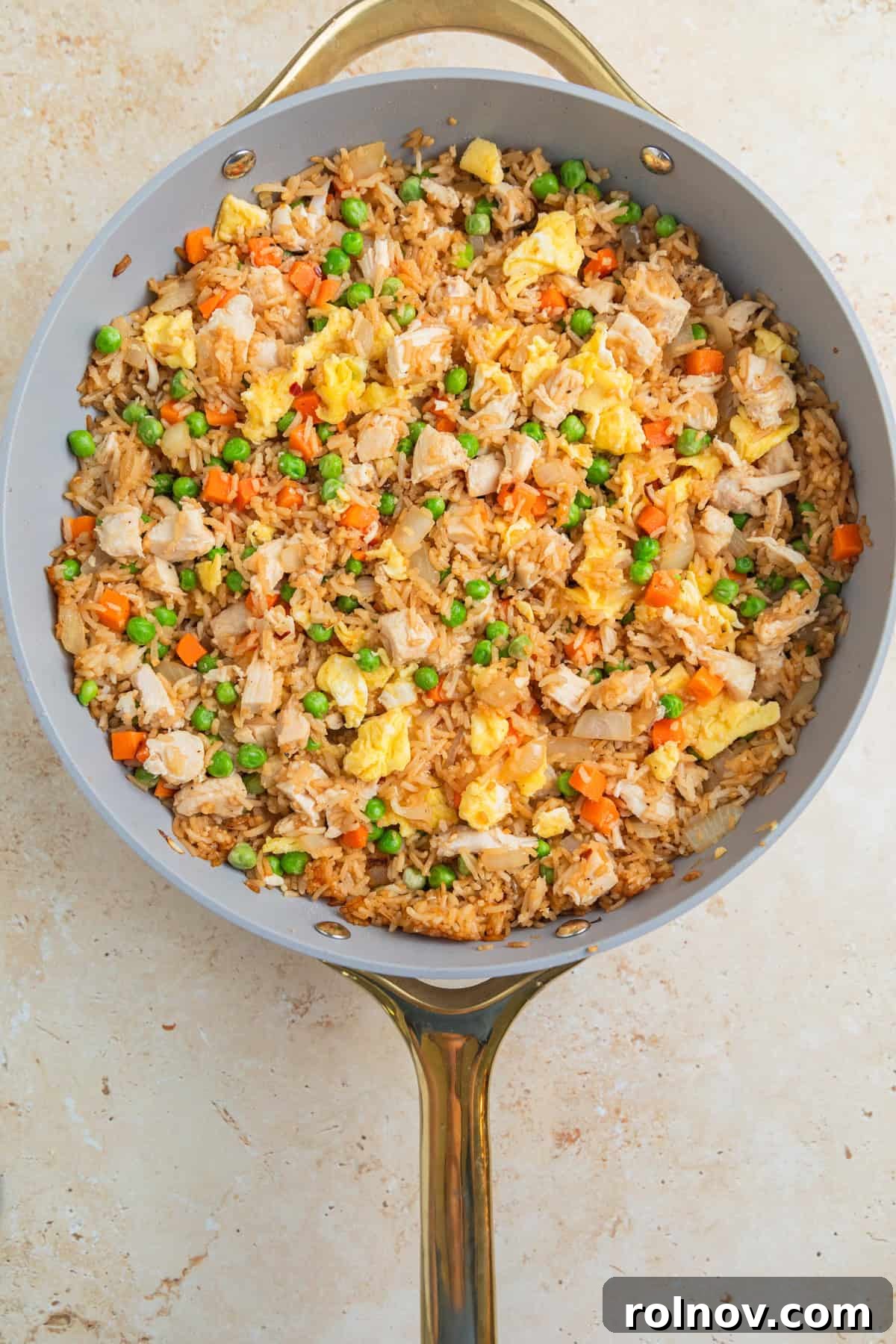 Quick Homestyle Chicken Fried Rice 9 Finished easy chicken fried rice in a large skillet, ready to be served.