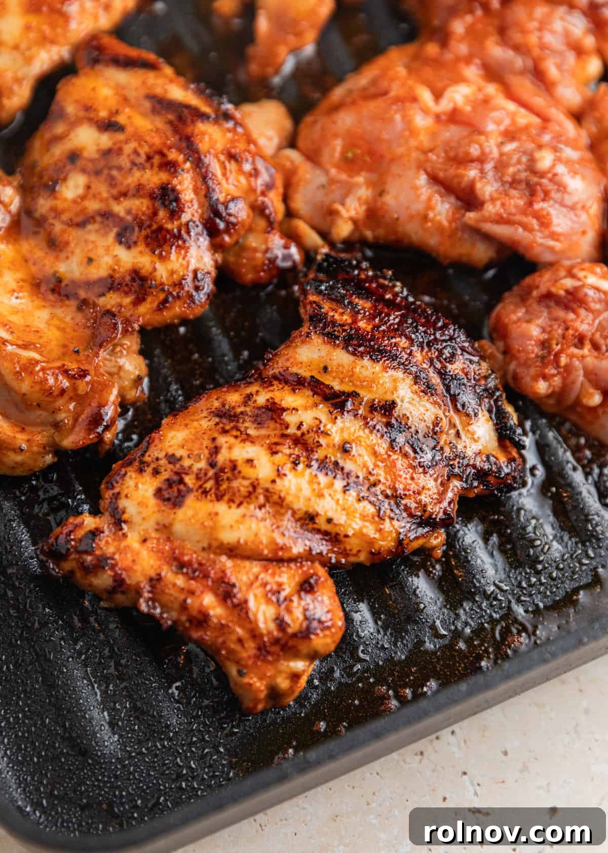 Chicken on grill pan after flipped.
