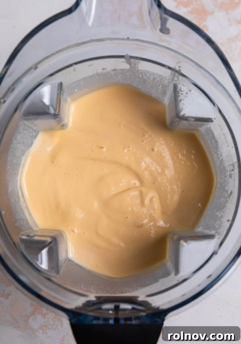 Peaches & Cream Pops 4 Peach popsicle mixture blended in blender.