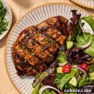 Grilled Balsamic Glazed Chicken Breast 10 Grilled balsamic chicken breast served on plate topped with chopped parsley.