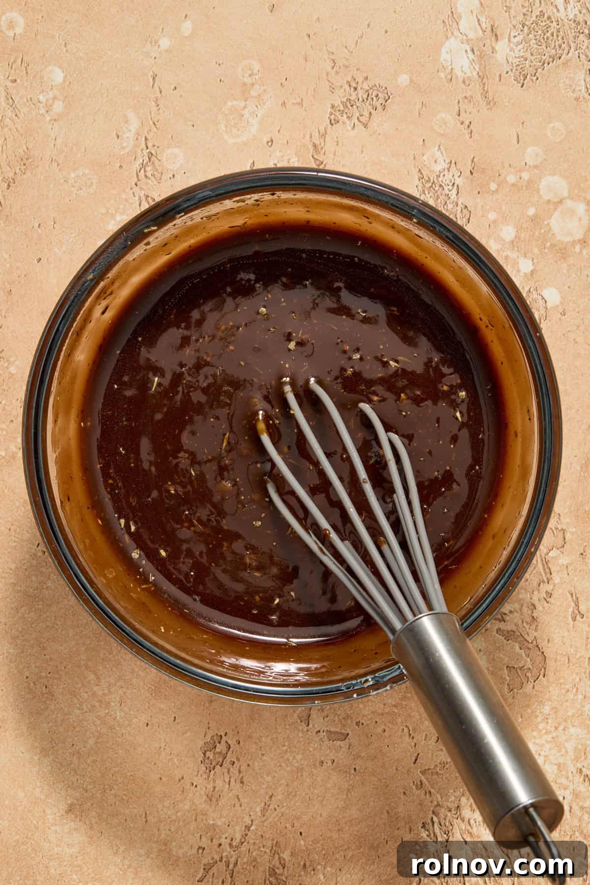 Grilled Balsamic Glazed Chicken Breast 5 Balsamic marinade in glass bowl with whisk.