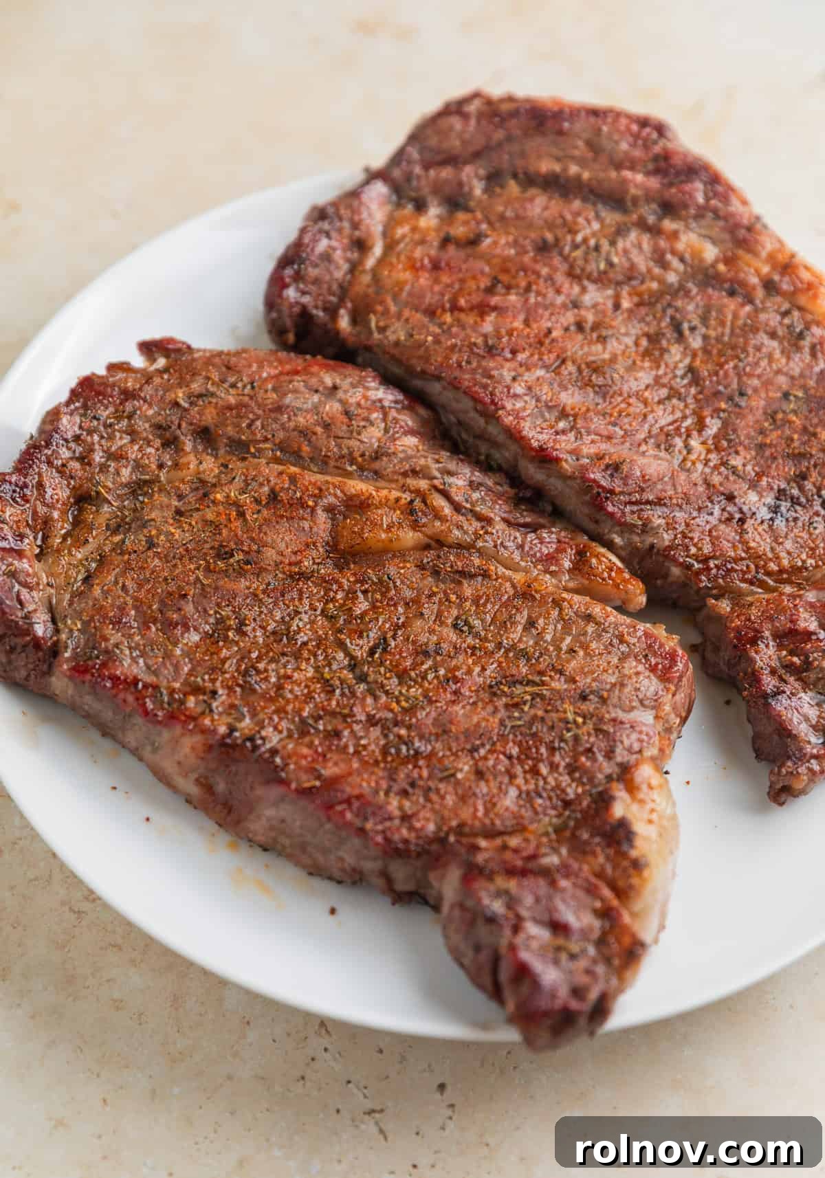Ribeye Perfection with Gorgonzola Cream 9 Resting grilled ribeye steaks.