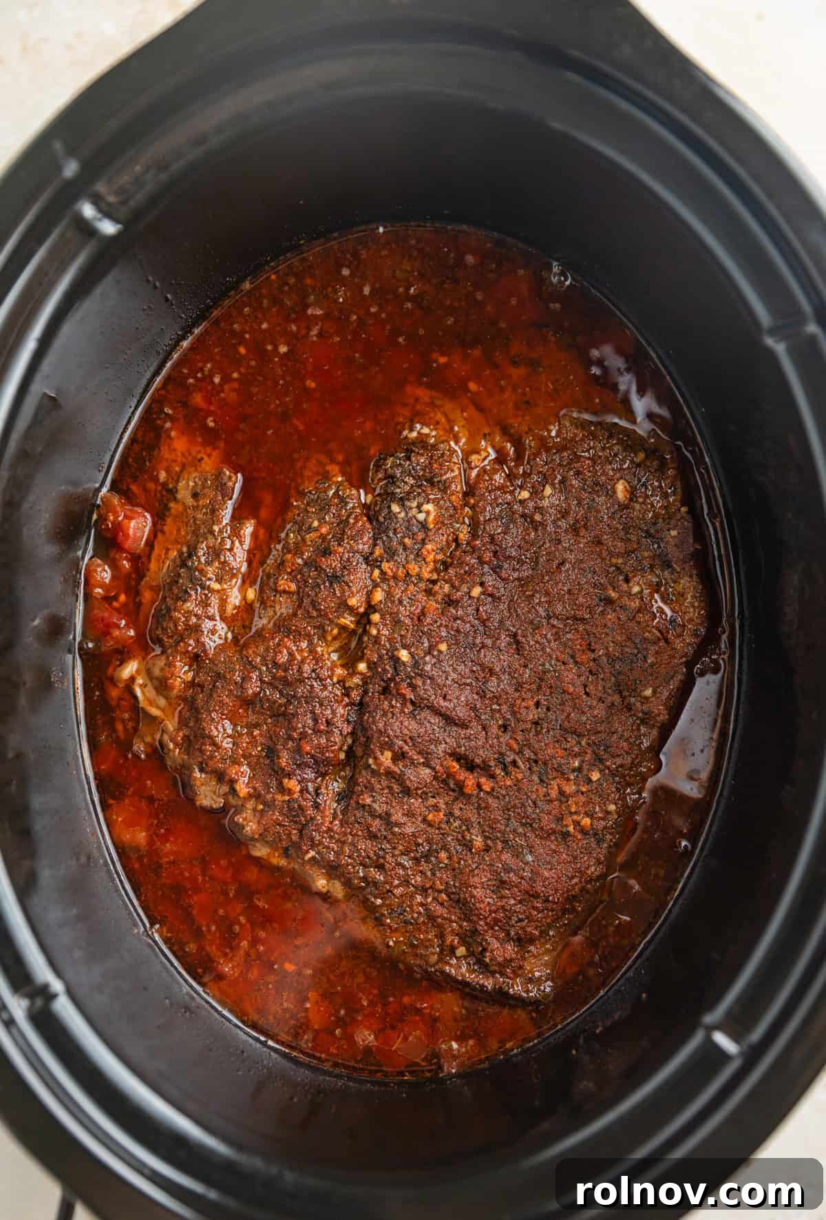 Melt In Your Mouth Slow Cooker Beef Tacos 7 Slow cooker beef cooked in juices in crockpot.