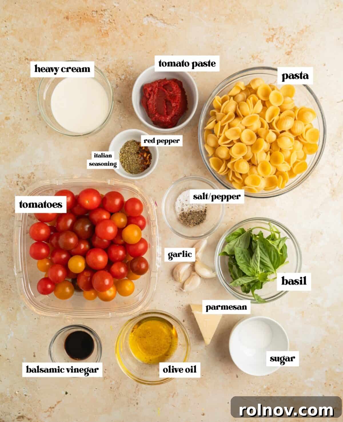 Sun-Kissed Cherry Tomato Delight 3 Arrangement of fresh ingredients including halved cherry tomatoes, vibrant basil leaves, a bottle of olive oil, minced garlic, and various seasonings, all laid out on a kitchen surface.