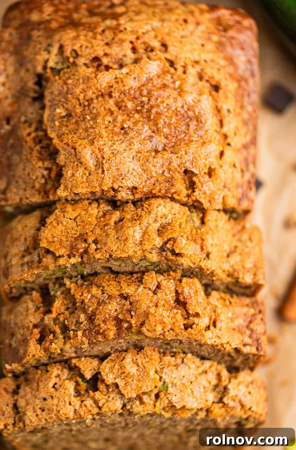 Grandmas Zucchini Bread Perfected 15 Arrangement of moist zucchini bread slices on parchment paper, highlighting their delightful texture.