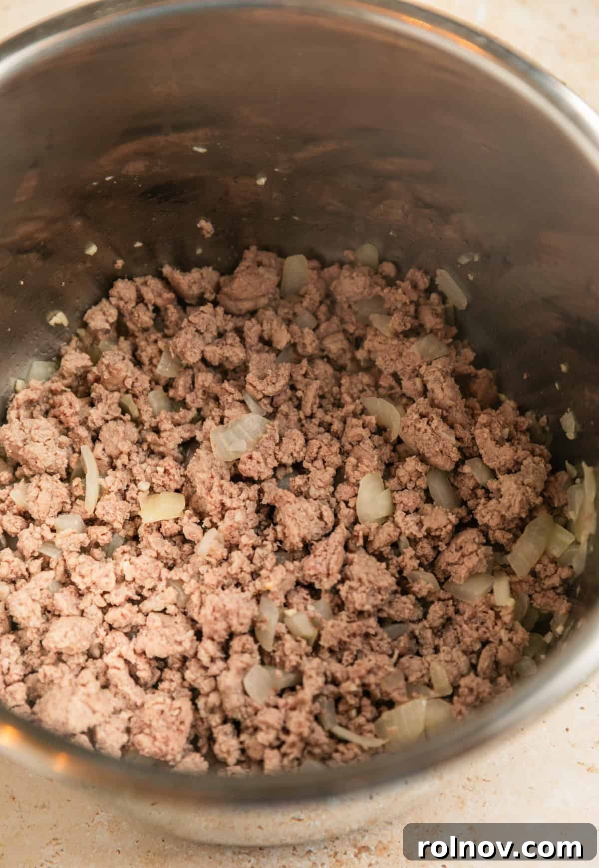 One-Pot Wonder Spaghetti 6 Ground turkey browning in the Instant Pot pressure cooker, creating a rich base for the spaghetti sauce.