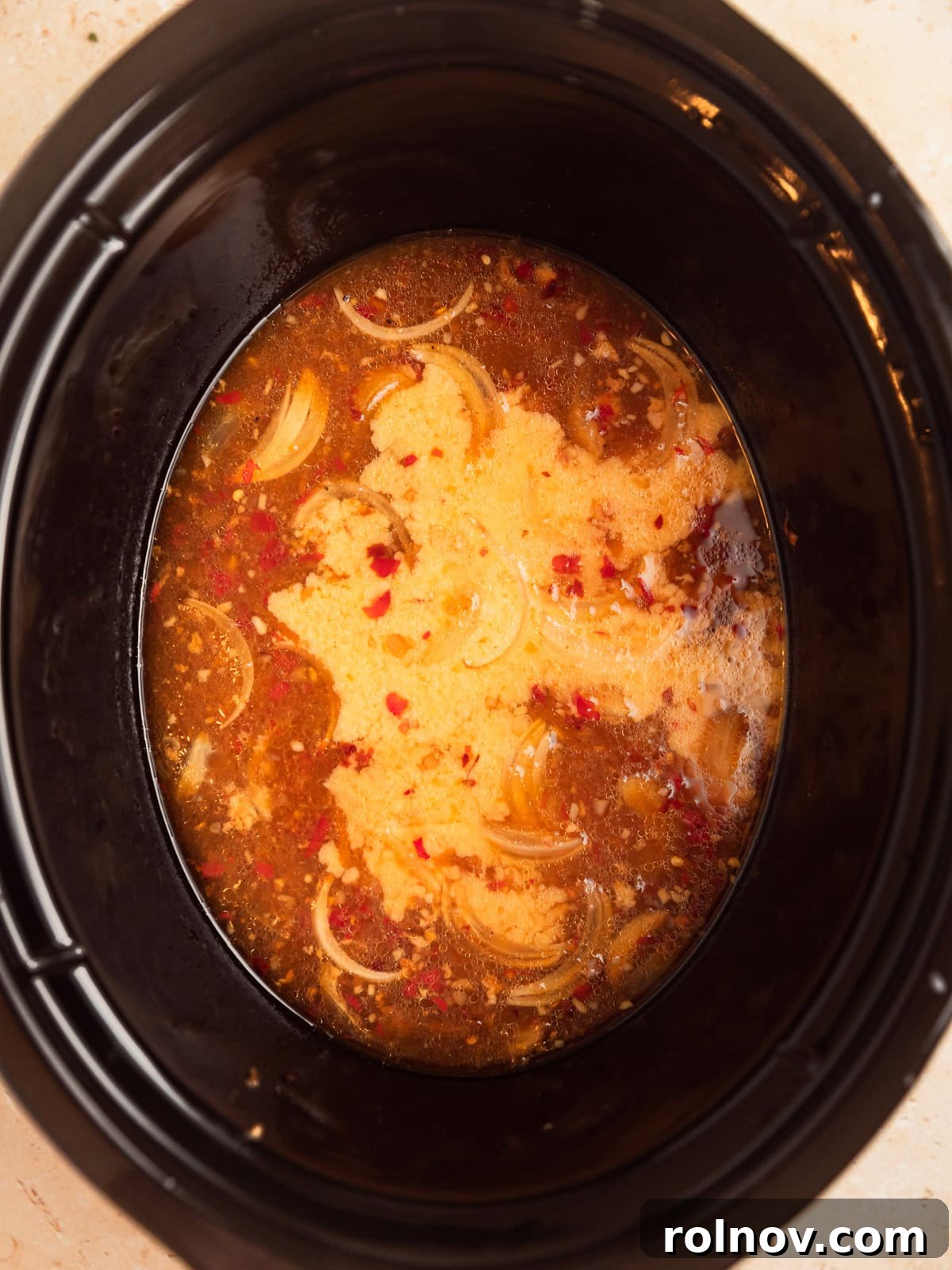 Sweet and Savory Apricot Slow-Cooked Chicken 8 Slurry added to apricot mixture in crockpot.
